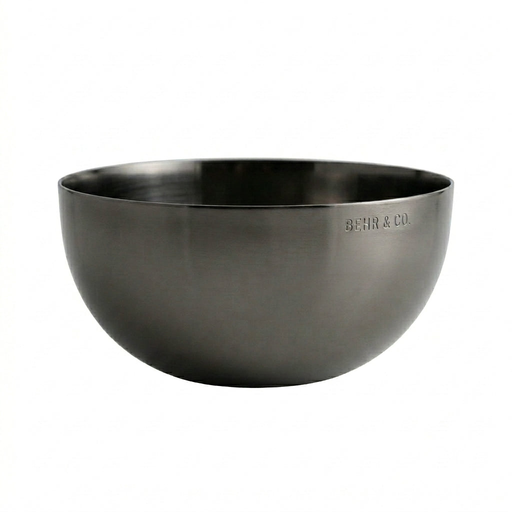 Black bowl with 'BEHR & CO' branding on a white background