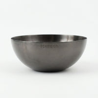 Stainless steel bowl with 'BEHR & CO.' engraving on a white background