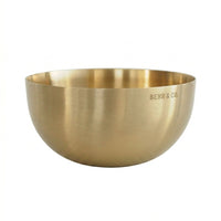 Gold bowl with 'BEHR & CO.' engraving on a white background