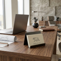 Laptop on a wooden desk with a Behr & Co product in the foreground, in an office setting.