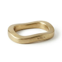 Gold stylish show piece with 'BEHR & CO.' branding on a white background