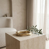 Gold stylish show piece on a stone surface with a neutral background