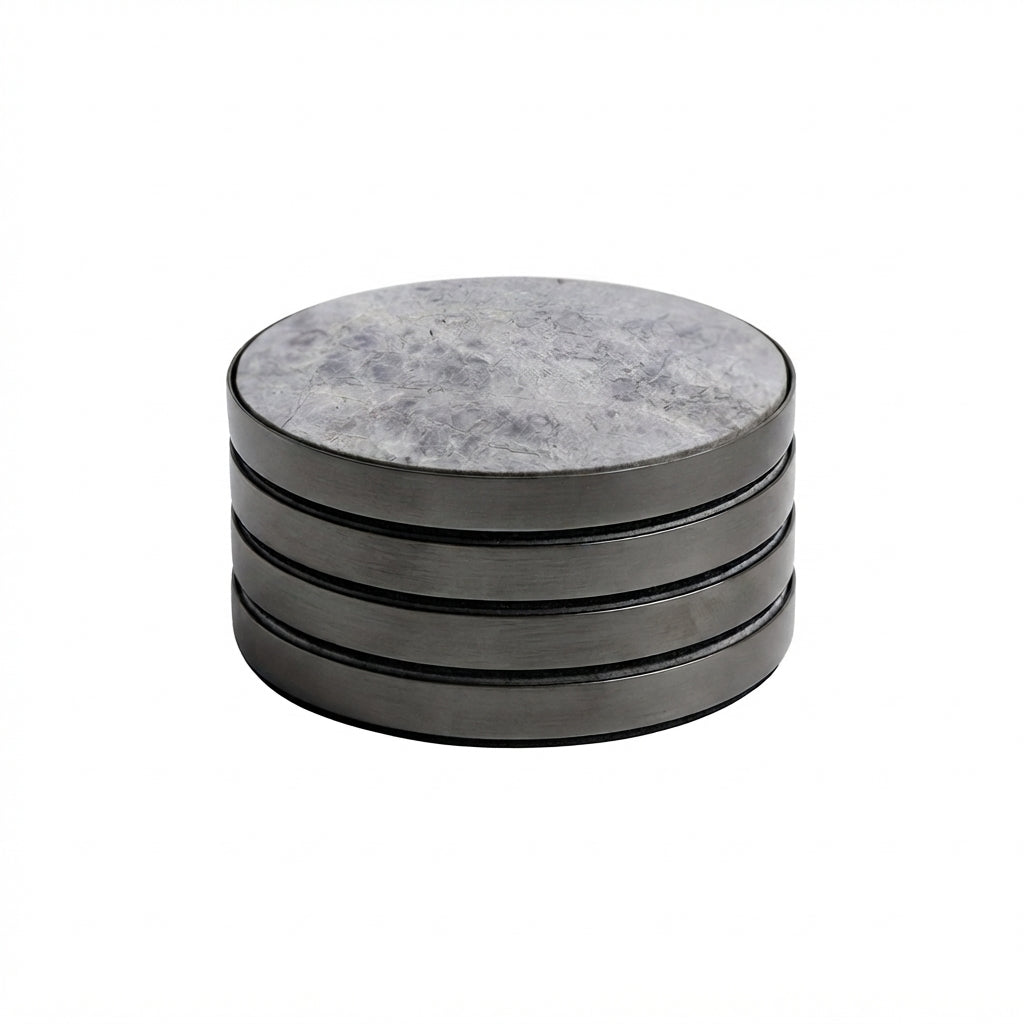 A stack of four round coasters with a gray marbled top surface and dark gray metallic sides, shown on a plain white background.