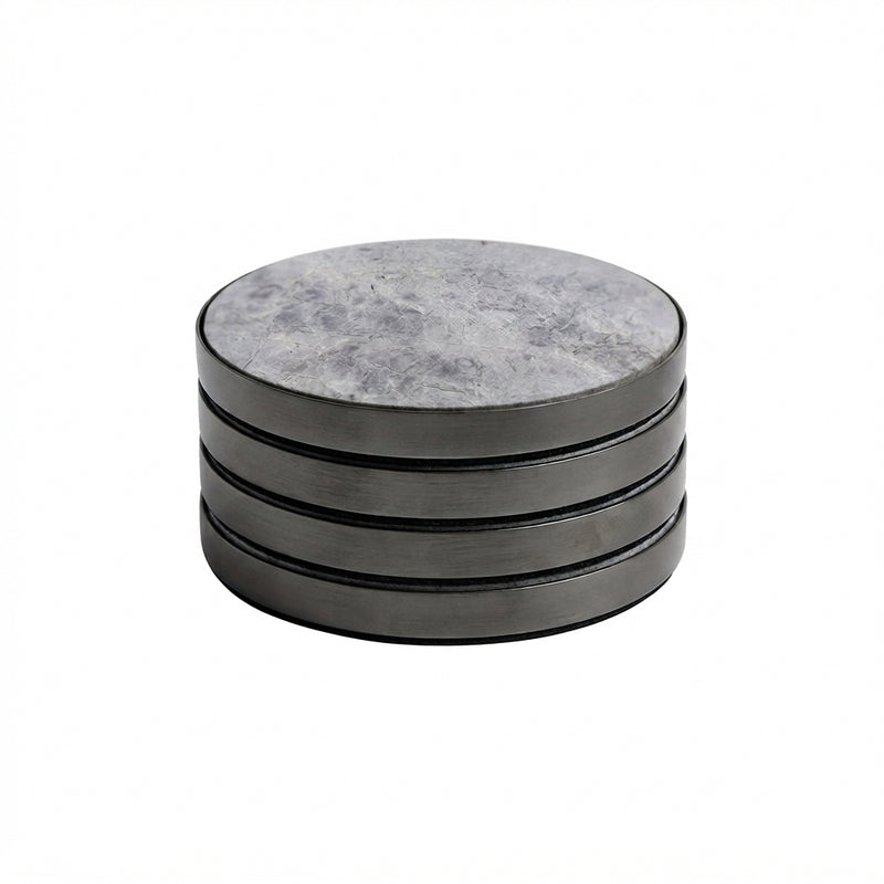 A stack of four round coasters with a gray marbled top surface and dark gray metallic sides, shown on a plain white background.