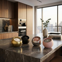 Modern kitchen with various bowls on a marble countertop