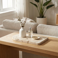 Decorative stone tray on a wooden coffee table in a living room setting